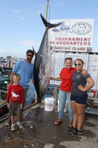 The author and her family with the Bluefin Tuna they caught as part of the Casco Bay Classic. The fish weighed 169 pounds dressed.