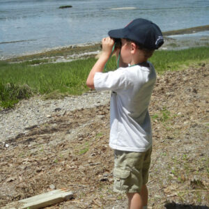 child using binoculars