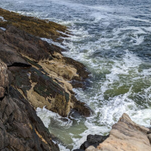 waves crash on rocks