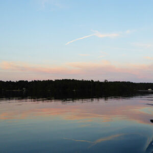 sky just after sunset in pastel colors with sky reflected on calm water