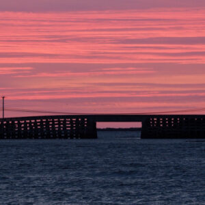 pink sky behind cribstone bridge
