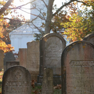 sunrise among gravestones at cemetery