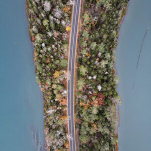 aerial view of road running through tree-covered island