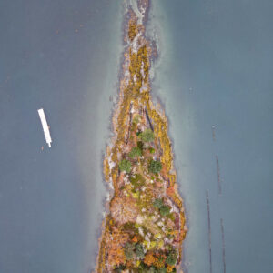 aerial view of orange and green island surrounded by gray water