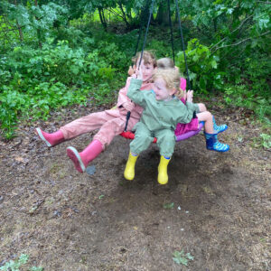 children smile on swing