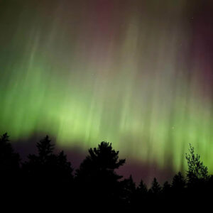 green aurora in night sky