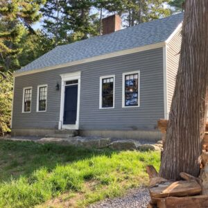 gray house with blue front door