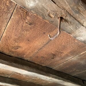 hook hangs from ceiling
