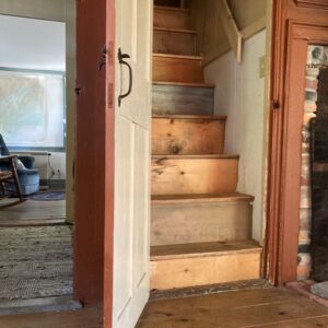 narrow door opens to steep staircase