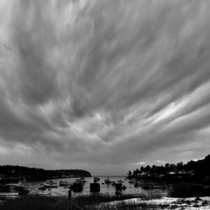 black and white photo of clouds over mackerel cove