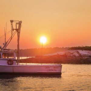 boat on water at sunset