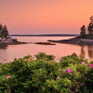 Islands in water at sunset