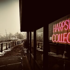 Building with neon sign "Harpswell Collective"
